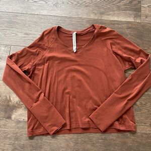 Lululemon safely tech long sleeve rust color -hip length -